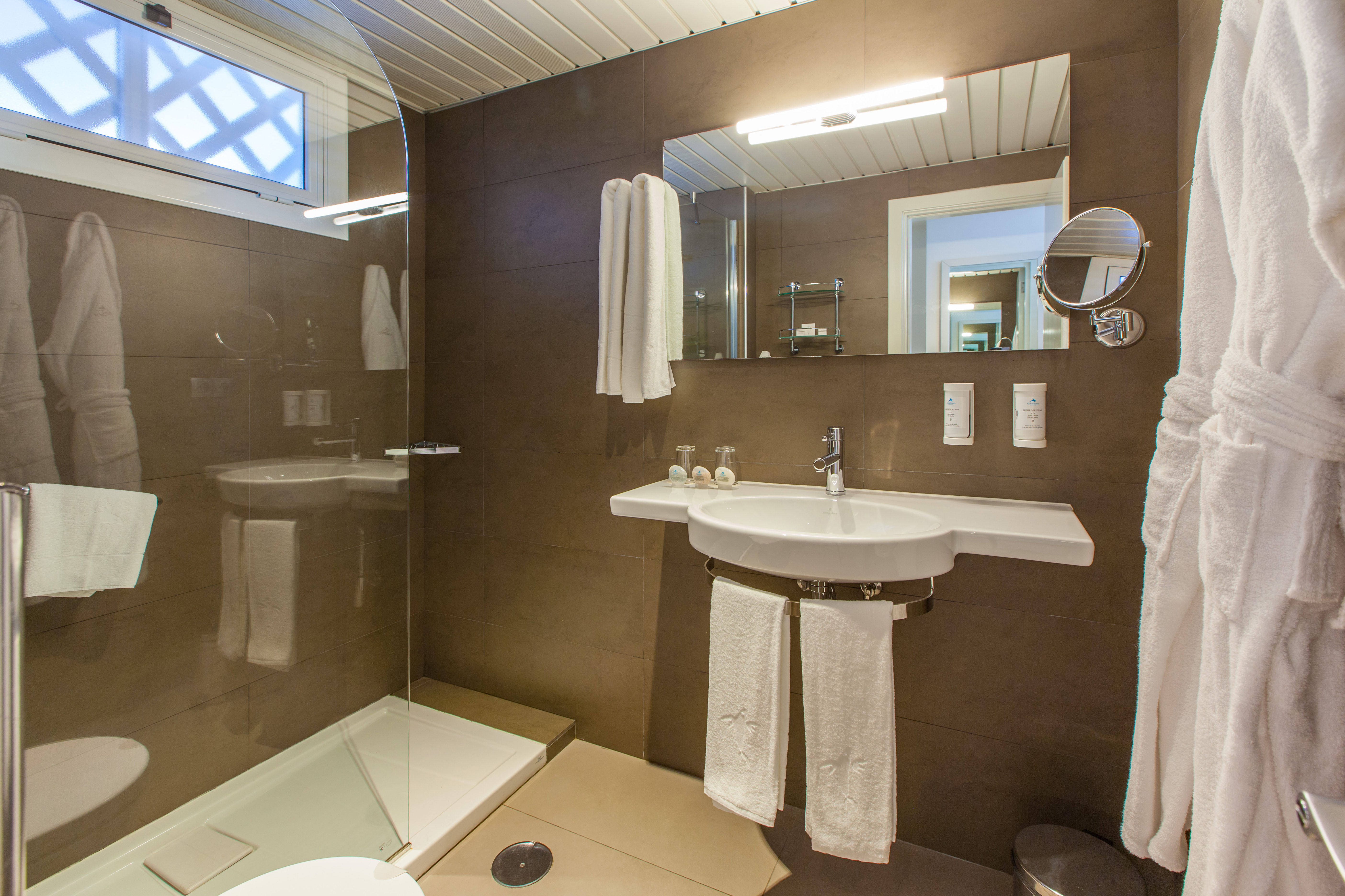 bathtroom corallium beach by lopesan hotels junior suite