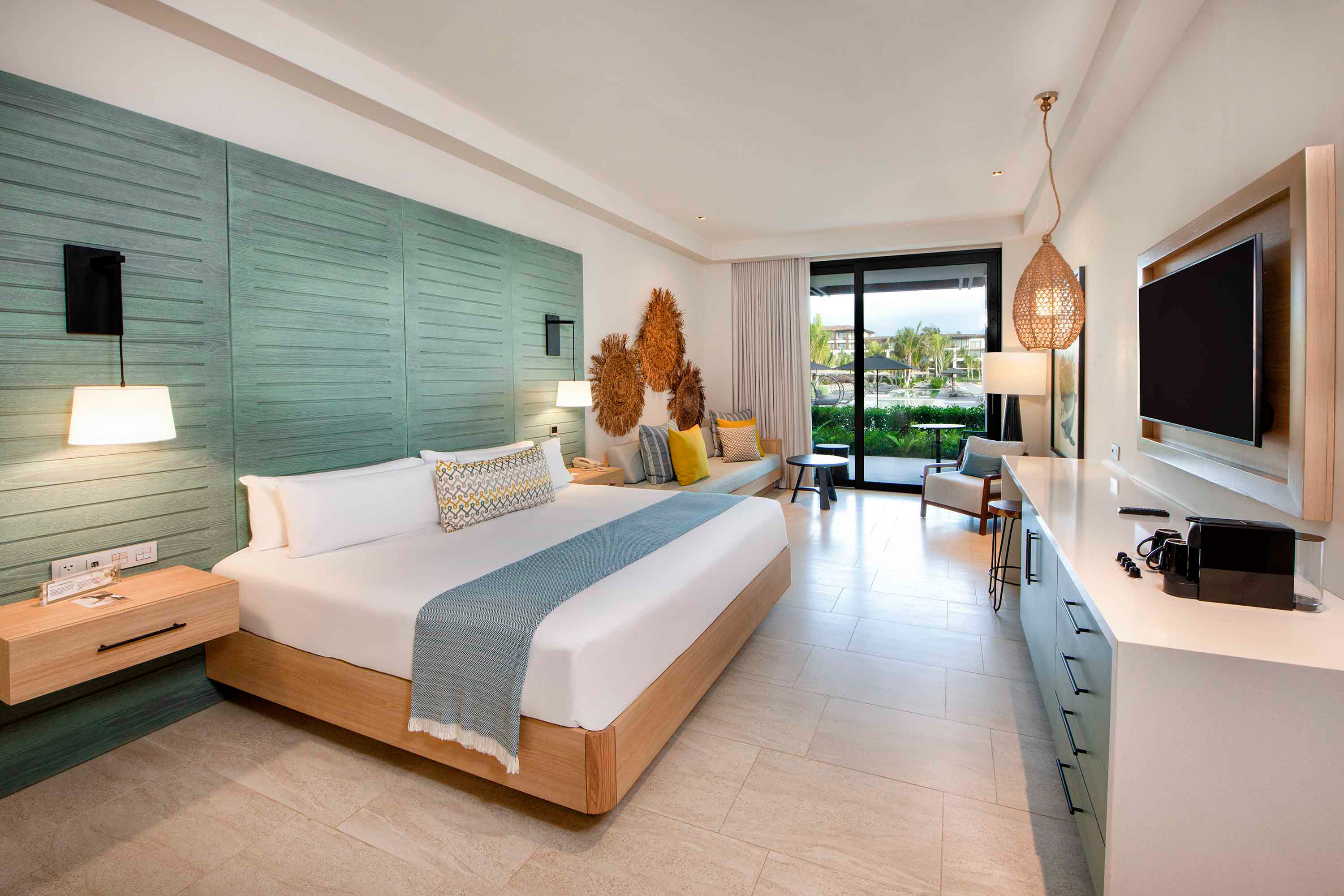 bed resort king pool view junior suite lopesan costa bavaro resort, spa & casino