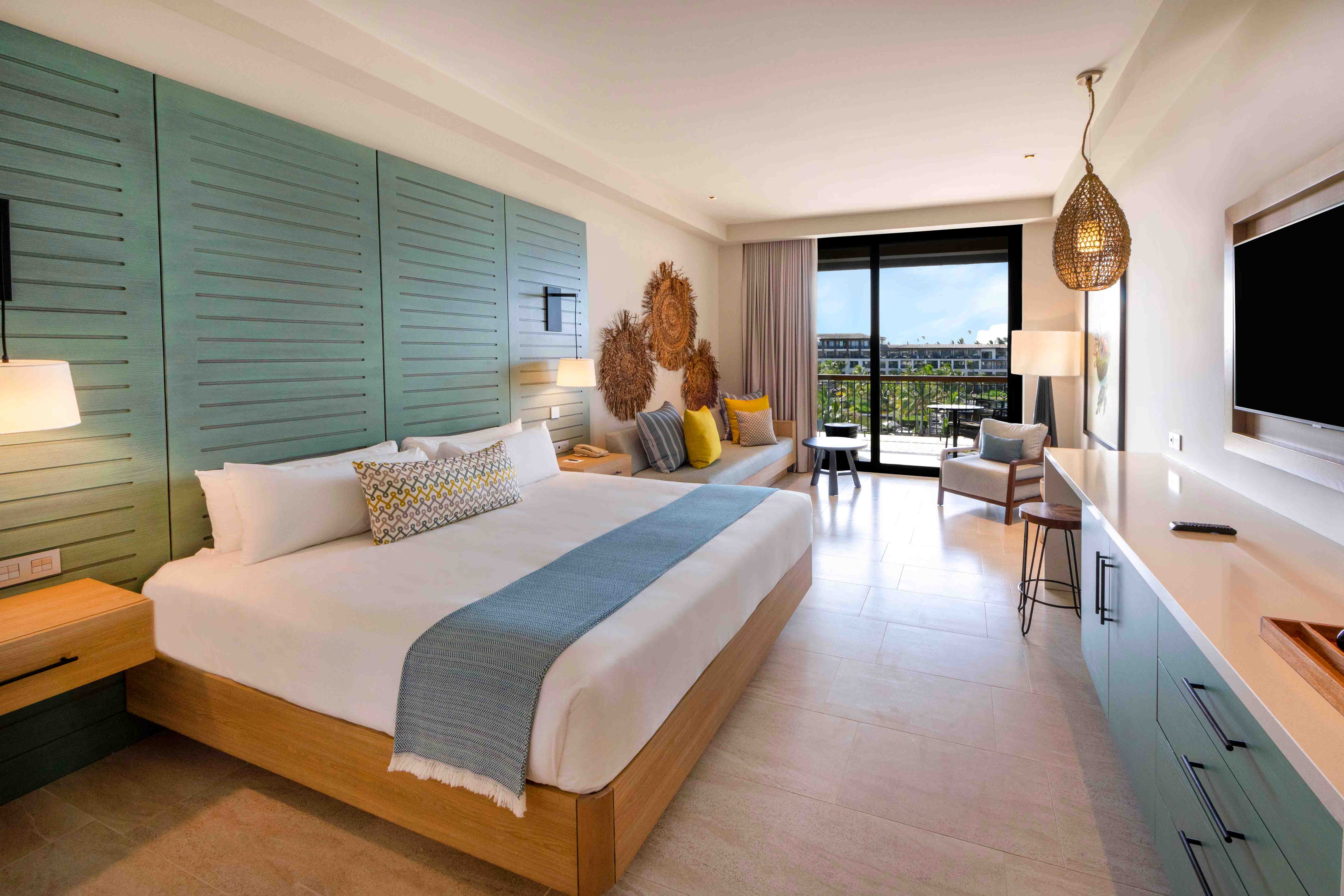 bed unique king ocean view junior suite lopesan costa bavaro resort, spa & casino
